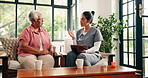 Old woman, nurse and talk with clipboard on sofa for prescription, explain and schedule for medicine. People, caregiver and senior patient with checklist, wellness review or advice in retirement