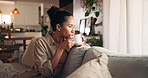 Thinking, sofa and woman with coffee for drink, reflection and wellness in morning. Home, living room and person with beverage, comfort and tea for peace and relax or resting for weekend break