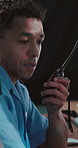 Radio, security guard or man in office, talking or cctv monitor for protection, feedback or report. Person, building safety or employee in control room, surveillance agency or two way intercom system
