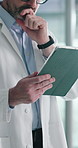 Medical, thinking or man in clinic with tablet, research or patient insight in online consultation. Healthcare, reflection or mature doctor with tech, telehealth or record review for treatment plan