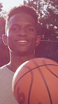 Confidence, face or player on basketball court with ball, fitness hobby or practice on weekend break. Pride, portrait or man outdoor with roundball, hoop sport and training session with athletic game