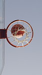 Below, basketball and net in game with score, goal success and shooting skills for winning competition. Hoop, rim and sports contest outdoor with point, victory and target achievement for tournament.