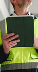 Engineer, man and hands in building with tablet, project inspection and property development compliance. Mature person, tech and quality assurance on site for renovation, remodeling and construction.