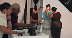 Model, women and makeup artist with brush, backstage and photoshoot preparation and beauty makeover. Behind the scenes, people and foundation application with tools, creative and production setup