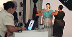 Model, makeover and makeup artist with brush, backstage and photoshoot preparation or beauty process. Behind the scenes, people and foundation application with tools, creative and production setup