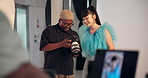 Man, photographer and talk to model with camera, review picture and results of photoshoot. People, chat and check equipment for photography selection, feedback and pose guidance for fashion magazine