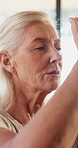 Old woman, prayer hands and meditation with yoga for wellness, breathing exercise or eyes closed at gym. Elderly person, mudra and holistic fitness with mindfulness, namaste or retirement at club
