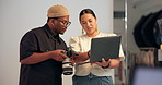 People, photographer and camera with laptop in studio, review pictures and filming catalog. Team, talking and equipment with photography selection, feedback and editing guidance for fashion magazine