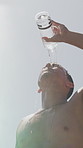 Athlete, man and water on face outdoor for summer fitness, refreshing liquid and exercise recovery. Below, shirtless and male person with beverage, sweat control and cool down from training challenge