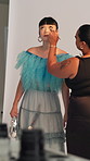 BTS, makeup and photoshoot with model in studio for advertising campaign or fashion magazine. Cosmetics, getting ready or photography with stylist and woman on set for catalog or production session