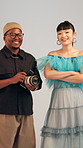 Face, photoshoot and people in studio, camera for production process and creative project. Freelancer, man and woman with photographer, equipment and shooting for media industry, artist and backstage