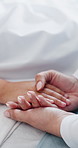 Sick kid, family and holding hands in hospital, comfort and help with empathy for disease diagnosis. Closeup, parent and child in clinic, healthcare or recovery for post surgery treatment or sympathy