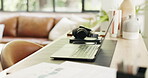 Headphones, mobile or laptop setup in home office, research or planning document for remote work. Creative workspace, phone or computer with audio tech for freelance efficiency, internet or paperwork