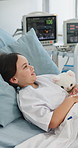 Girl, patient and IV drip with teddy bear on hospital bed for medical treatment or medication. Child, kid or smile with stuffed animal or toy for healthcare checkup, exam or tests in clinic room