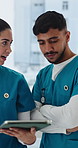 Advice, doctors and people in clinic, tablet for healthcare tips and teamwork for medical service. Email, man and woman in hospital, tech and digital app for medicine inventory, support and talking