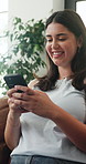 Home, funny and woman on sofa, smartphone for texting and digital app for social media. Smile, laughing and person on couch, happiness or cellphone for connection, online humor or website information