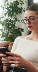 Home, typing and woman on sofa, smartphone for texting and digital app for message to contact. Apartment, mobile user and person in lounge, internet or cellphone for connection, email or website info