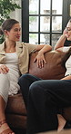 Talking, relax and women on sofa in home for conversation, chat and hangout in living room. Apartment, friends and people on couch for communication, discussion or bonding for social visit on weekend