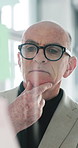 Glass, investor and man in office, thinking and planning for investment deal, profit growth and eyewear. Mature person, employee or financial advisor in workplace, clear vision and choice for trading