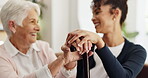 Hands, healthcare or walking stick with nurse and old woman in home living room for wellness. Cane, medical or support with happy caregiver and senior patient in apartment for checkup or visit