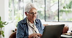 Laptop, typing and old woman in home with glasses, asset management research and prepare will online. Elderly person, reading and browsing in house with computer, pension annuity and estate planning.