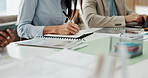 Woman, paperwork and business people with notebook in meeting for financial report, portfolio and planning. Corporate, team and person writing for investment strategy, statistics and finance agenda