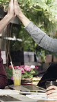 Laptop, meeting and business people in cafe with high five, remote work or success for marketing. Happy, team and celebration in restaurant with computer, food or achievement for advertising startup.