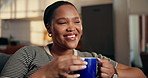 Thinking, sofa and African woman with coffee for resting, wellness and reflection on weekend. Home, happy and person on couch with beverage, drink and relax for calm, thoughtful and daydreaming
