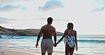 Back, couple and holding hands for date on beach with love, adventure and bonding on holiday. Space, black people and walk with partner support, lens flare and romantic getaway for vacation in nature
