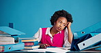 Tired, writer and black woman in studio, documents or low energy for deadline on blue background. Copywriting, African person or journalist at desk, burnout or workflow chaos for submission or stress