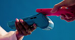Pos machine, hands and people in studio, smartphone for online payment and fintech on blue background. Closeup, cellphone and scan for purchase, transactions and tap for ecommerce and easy checkout