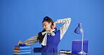 Stretching, student and woman with smile, education and research with laptop, knowledge and thinking. Studio, blue background and person with books for exam preparation, space or relax on study break