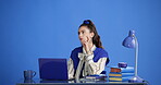 Serious, student and woman with laptop, thinking and planning for assignment with research or space. Blue background, reflection and person with tech for quiz, education and typing ideas in studio