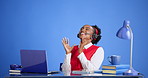 Call center, laugh and businesswoman with headset in studio with laptop for communication or crm. Computer, mic and female technical support agent with online consultation by blue background.