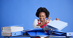 Stress, folders and black woman with documents for overworked, burnout or fatigue with finance project. Paperwork, exhaustion and African female financial advisor with chaos by blue background.