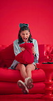 Cushion, screaming or woman on sofa in studio, frustrated or anger expression on red background. Pillow, shout or person on couch, lose control or stress for mental health or emotion for ptsd memory
