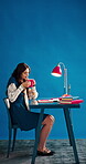 Coffee, aroma and woman with books, studio and student with caffeine on study break or mockup space. Person, sniffing and relax with hot tea, blue background and education with college scholarship