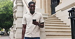 Phone, smile and stairs with business black man outdoor in city for communication or update. App, buildings and text message with happy African employee in urban town for social media scrolling