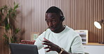 Headset, laptop and talking with black man in call center for assistance, help or online support. Computer, conversation and customer service with African employee in office for contact or solution