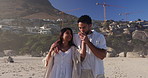 Love, walk and couple kiss at beach for care, holding hands and talking on vacation with partner. Hug, man and woman travel outdoor for summer holiday, support and happiness on tropical island