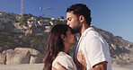 Travel, forehead kiss or couple at beach with hug, commitment or bonding together on summer break. Love, man or woman with embrace, romantic connection or healthy relationship on seaside vacation.

