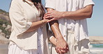 Love, walk and couple holding hands at beach for care, support and vacation getaway with partner. Connection, man and woman travel by ocean for summer holiday, trust and romance on tropical island