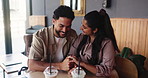 Couple, laughing and holding hands for date in restaurant, connection and bonding for healthy relationship. Smile, funny chat and people with support in smoothie bar, romance and affection for love