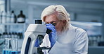 Analysis, microscope and science with woman in laboratory for development or investigation. Goggles, medical sample and research with mature scientist at work on clinical trial or experiment