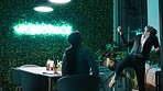 Applause, night and playful with business people in green office together at for eating or fun. Catch, food and late with employee women clapping in eco friendly workplace for bonding or support