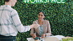 Design, feedback and tablet with business women in green office together for report or review. App, collaboration and plants on wall with employee people in workplace for sustainability project