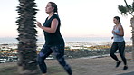 Women, friends and running for fitness at beach with exercise, training and cardio challenge. Athlete, people and lose weight with morning workout, endurance performance and race on promenade outdoor