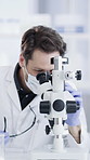 Scientist, laboratory and team with microscope for analysis, medical research and chemistry. Healthcare, biotechnology and people with solution sample for pathology, experiment or forensic PPE