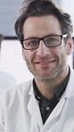 Science, face or man in lab with microscope, job or experience in vaccine development. Medical research, glasses or scientist in clinic with equipment, confidence or work in pharmaceutical study.
