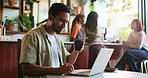 Laptop, remote work and man with drink in coffee shop for newsletter, blog or copywriting on website. Computer, latte and freelance copywriter in cafe for research, reading article or lead magnet